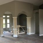 living room with arch doors